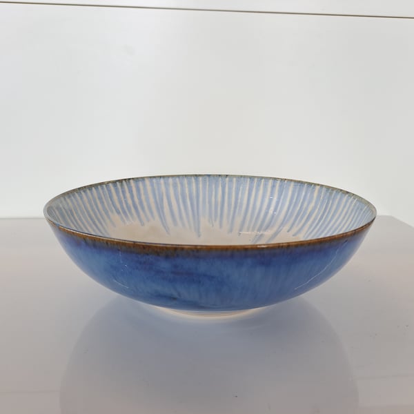 A LARGE LOW WIDE SERVING BOWL - glazed in blues and white