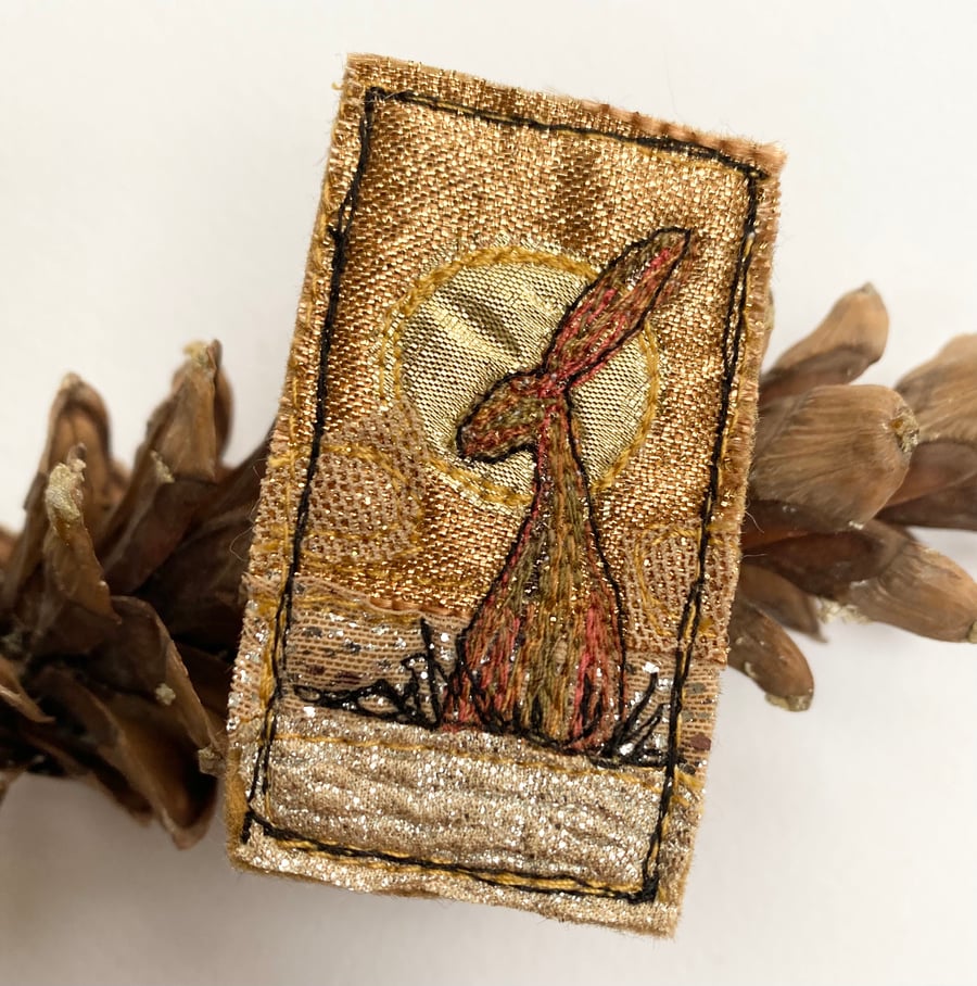 Upcycled harvest hare sunset brooch pin or badge. 