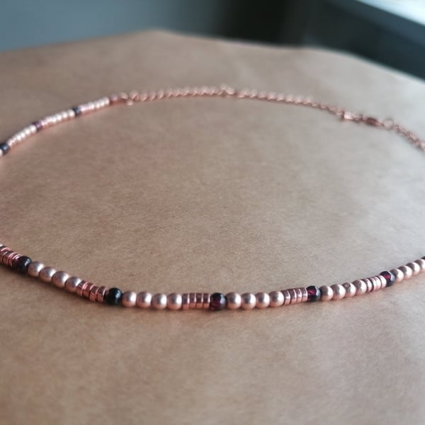 Garnet, hematite and rose ball necklace with a rose gold chain.