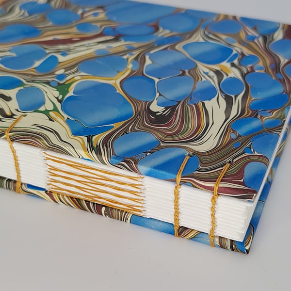 Handcrafted A6 coptic stitch notebook with recycled paper