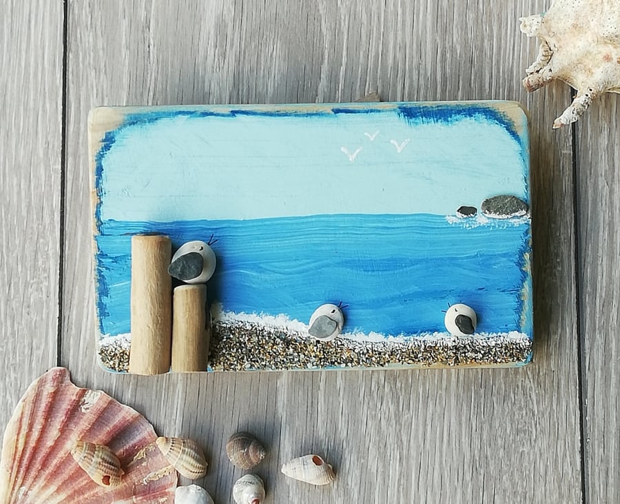 Pebble seagulls with driftwood groynes on palletwood plaques 