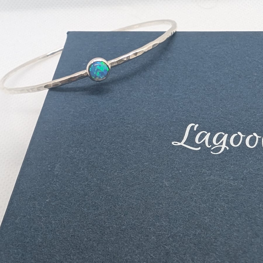 Sterling silver bangle with synthetic opal stone, hammered finish.