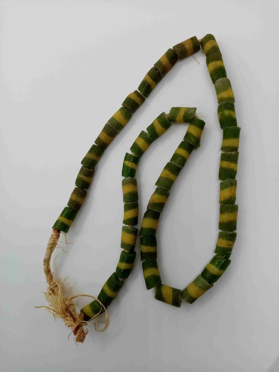 39 green powder glass beads with yellow stripe from Ghana