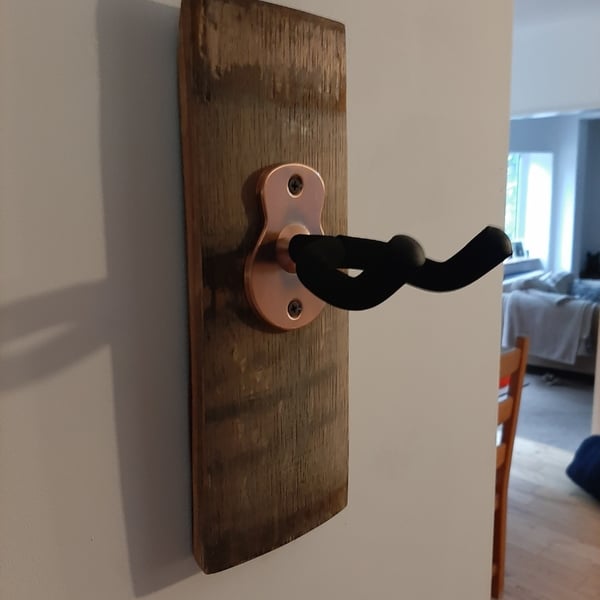 Guitar hanger unique Handcrafted from a whisky barrel stave.