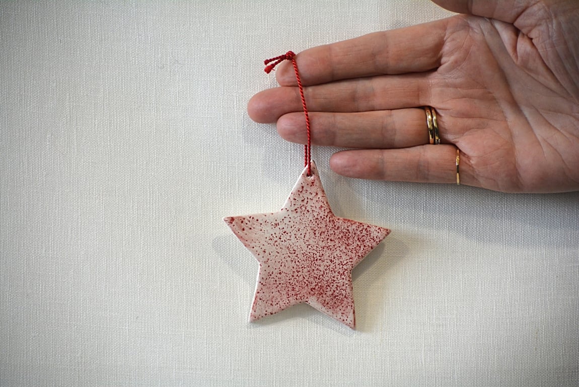 White porcelain star tree decoration with red speckled design