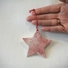 White porcleain star tree decoration with red speckled design