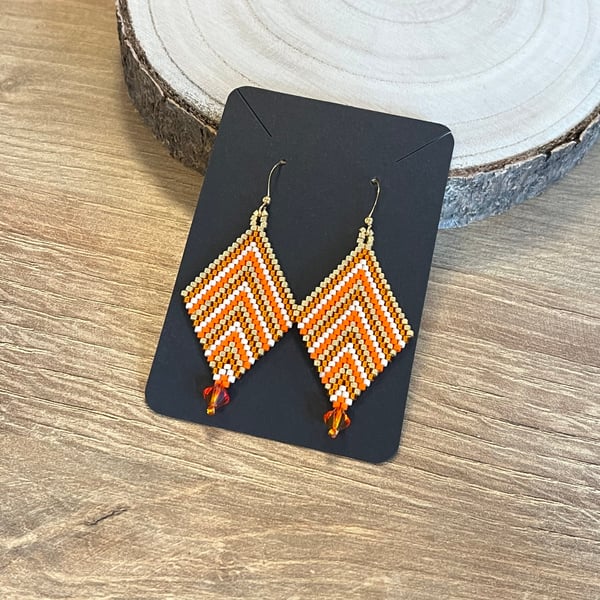 Colourful chevron earrings in orange and gold beadwork with a Swarovski drop 