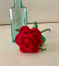 Single red rose in an antique bottle - Image 1