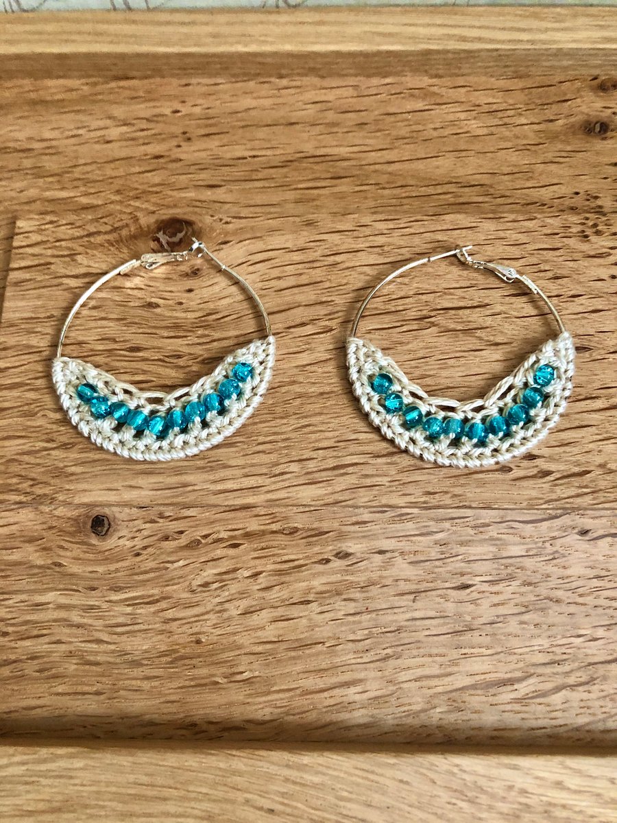 “Hello March” Silver plated hoop earrings with crochet and aqua design.