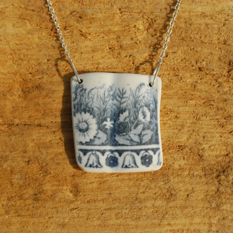 Beach pottery pendant with grey flowerbed 