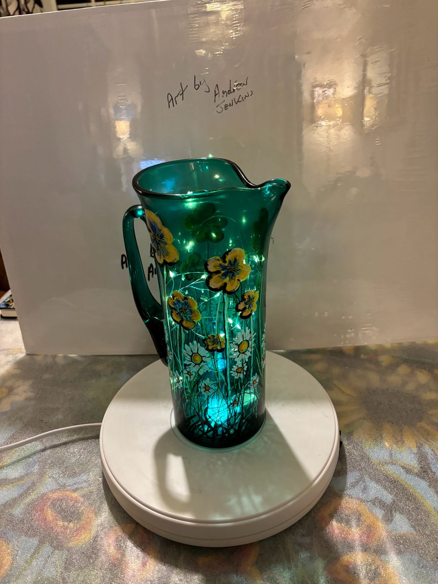 A hand painted and fired glass pitcher by Andrew Jenkins 