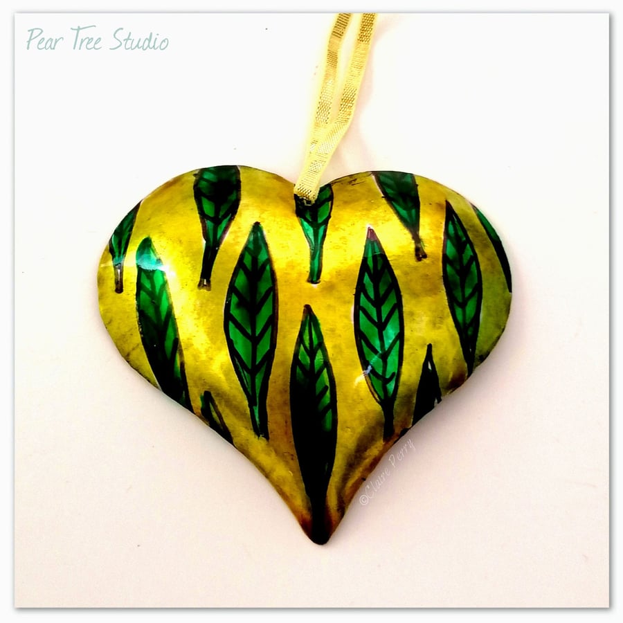 Handmade Small Yellow Metal Heart Decoration with a leaf pattern.