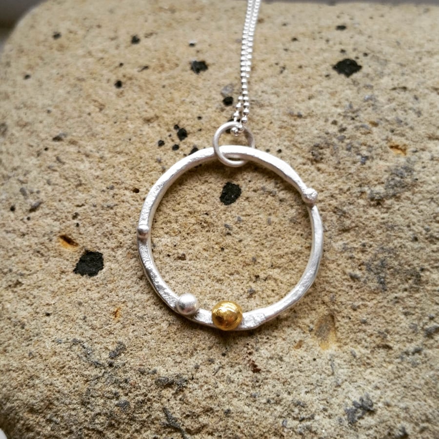 Textured sterling silver organic feel circle necklace with gold accent