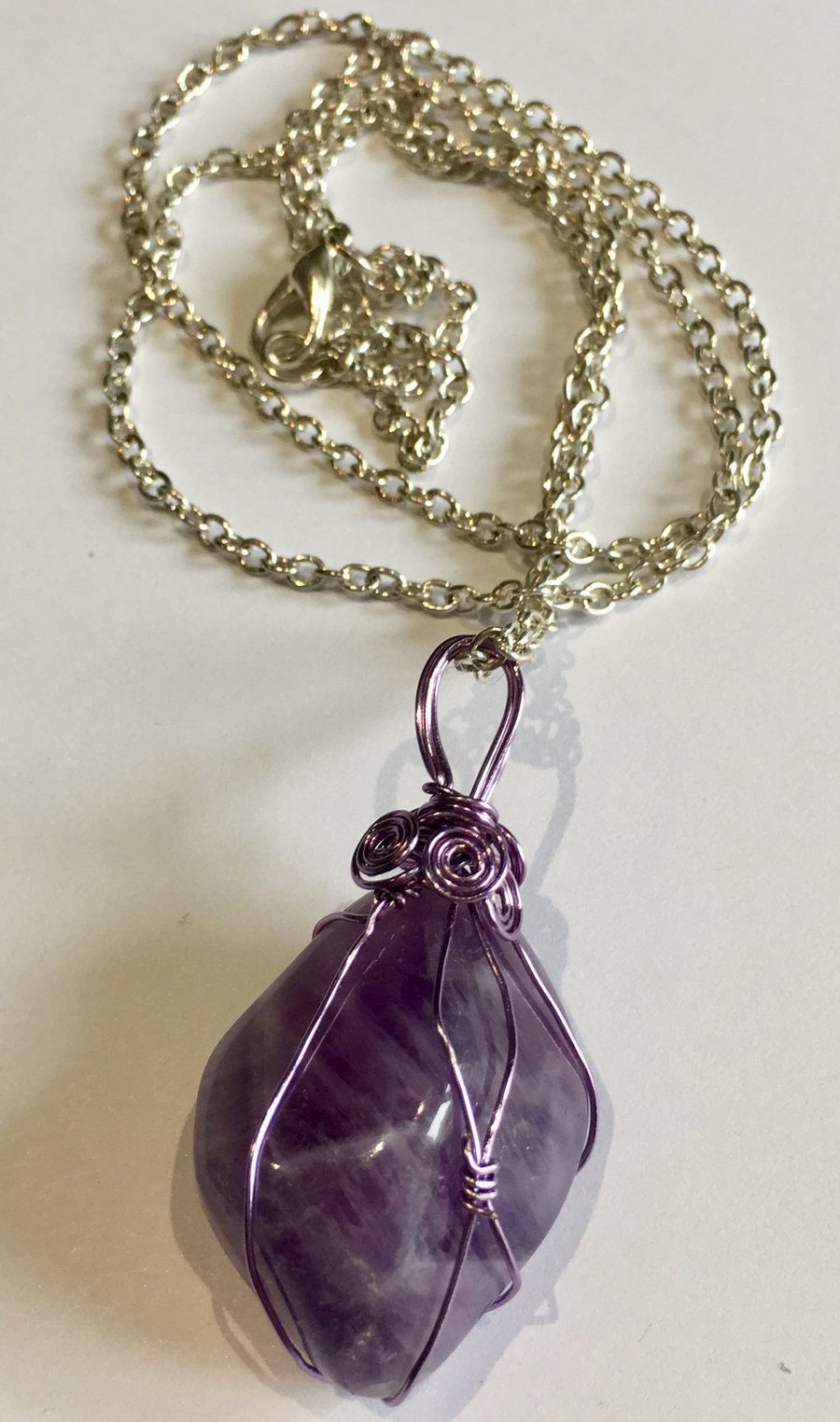 Amethyst Pendant encased in wire cage