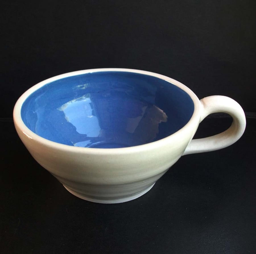 Ceramic teacup with blue interior