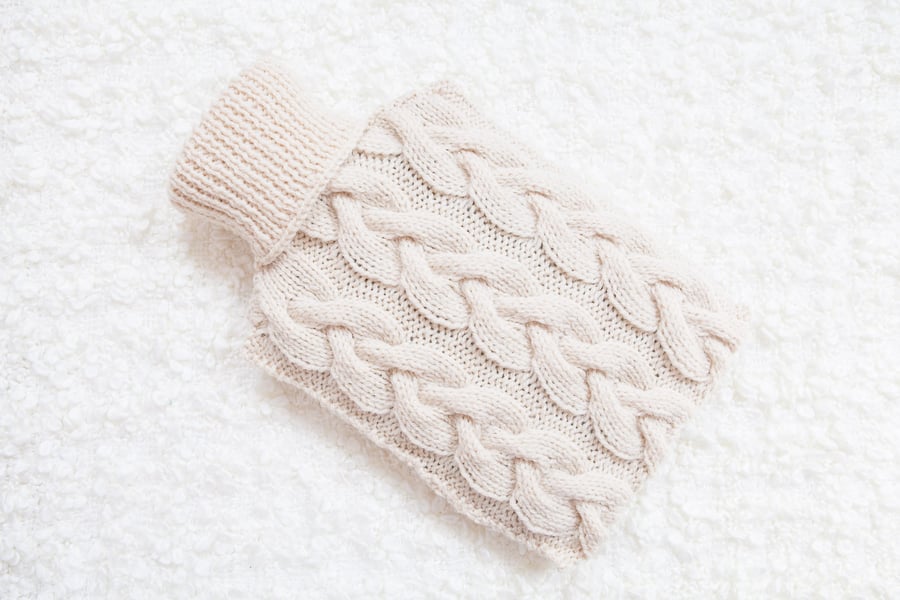 Hand knitted hot water bottle cover, cosy in cream. Rustic bedroom, home decor