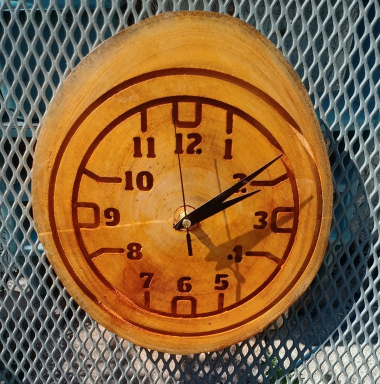 Handcrafted pine wall clock with quartz movement.