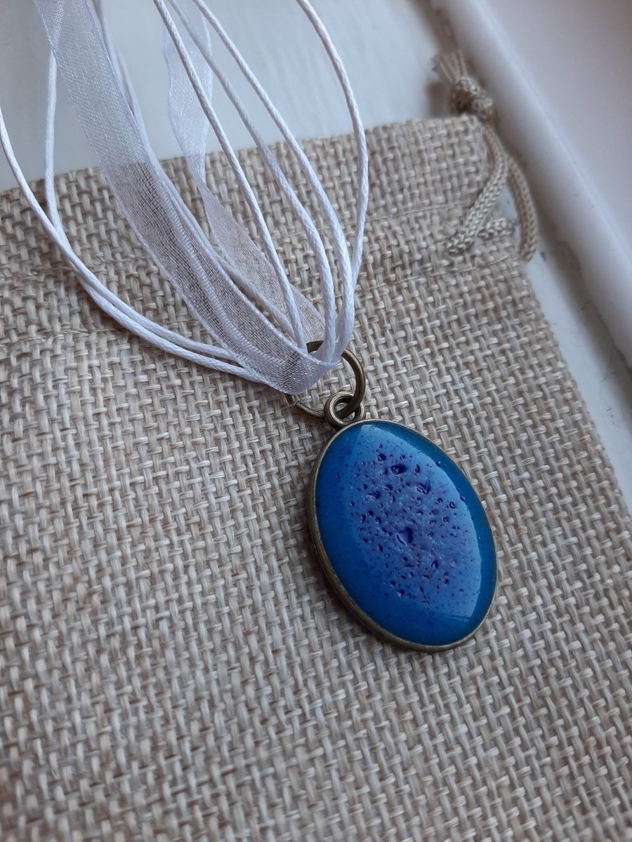 Dark blue oval resin pendent with white organza ribbon necklace 