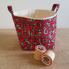Fabric storage container: red and black swirl design