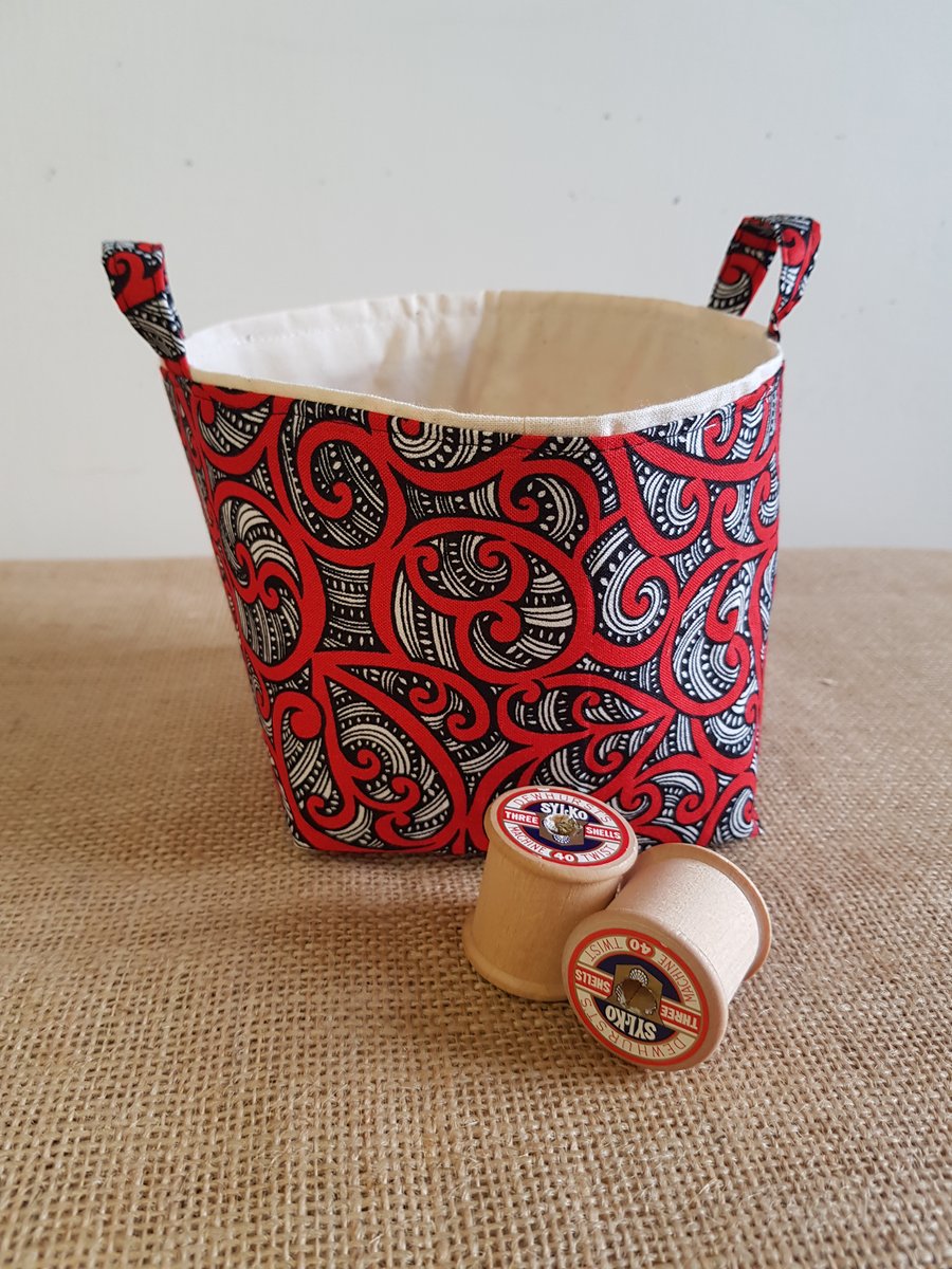 Fabric storage container: red and black swirl design