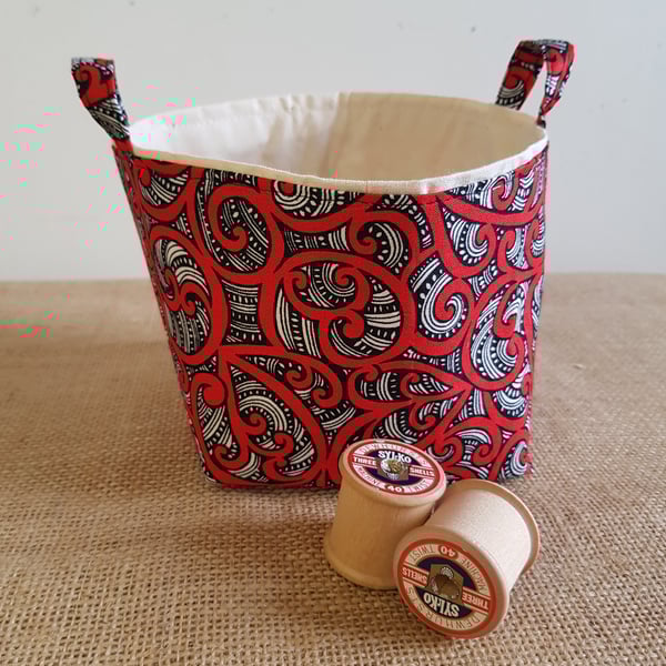 Fabric storage container: red and black swirl design