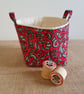 Fabric storage container: red and black swirl design