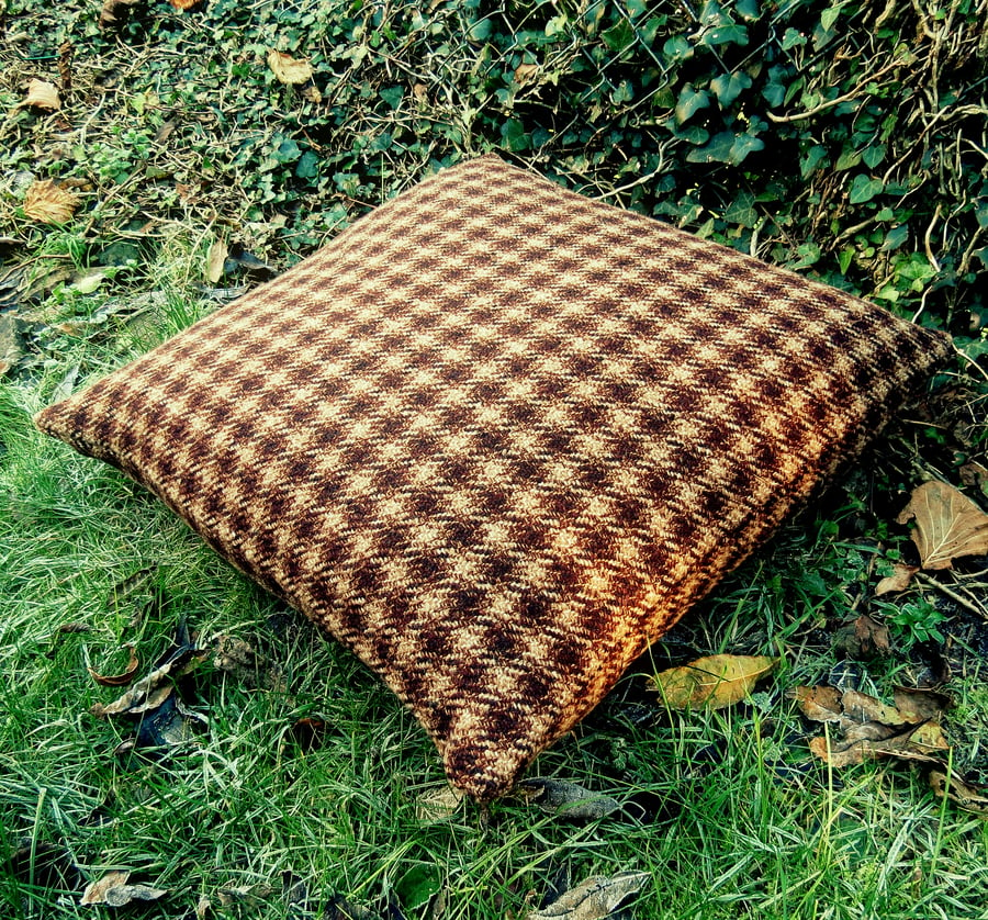 A tweed floor cushion. Complete with feather pad.  Made from pure wool.