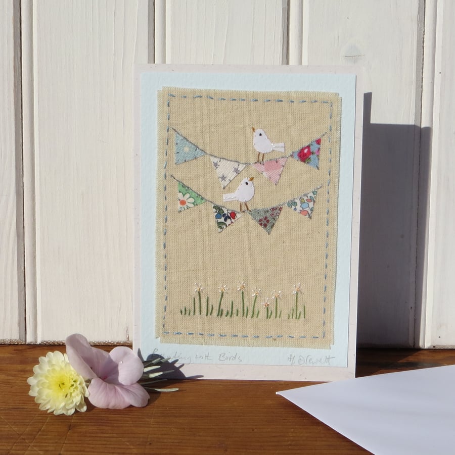 Hand-stitched mini bunting, little white doves, pretty card to keep!