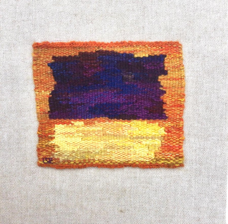 Unframed handwoven tapestry weaving, textile art in purple, yellow and orange