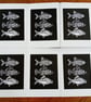 Linocut print of Three Little Fish handprinted in black - Image 3