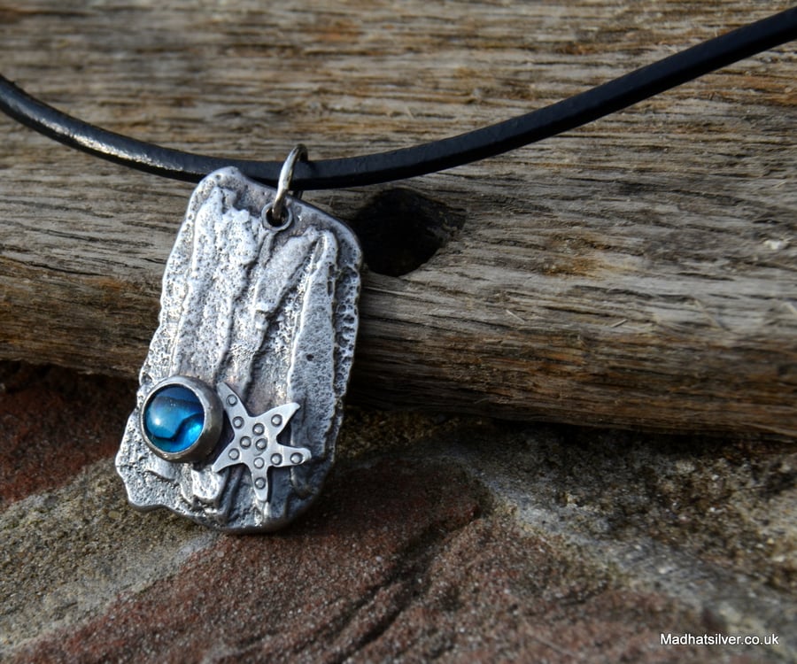 Silver cast 'driftwood' pendant with silver starfish and paua shell