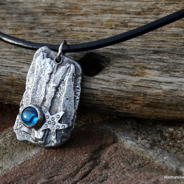 Silver cast 'driftwood' pendant with silver starfish and paua shell