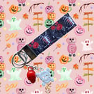 Halloween Printed Ribcage & Roses Wristlet Keychain with vintage skull charms