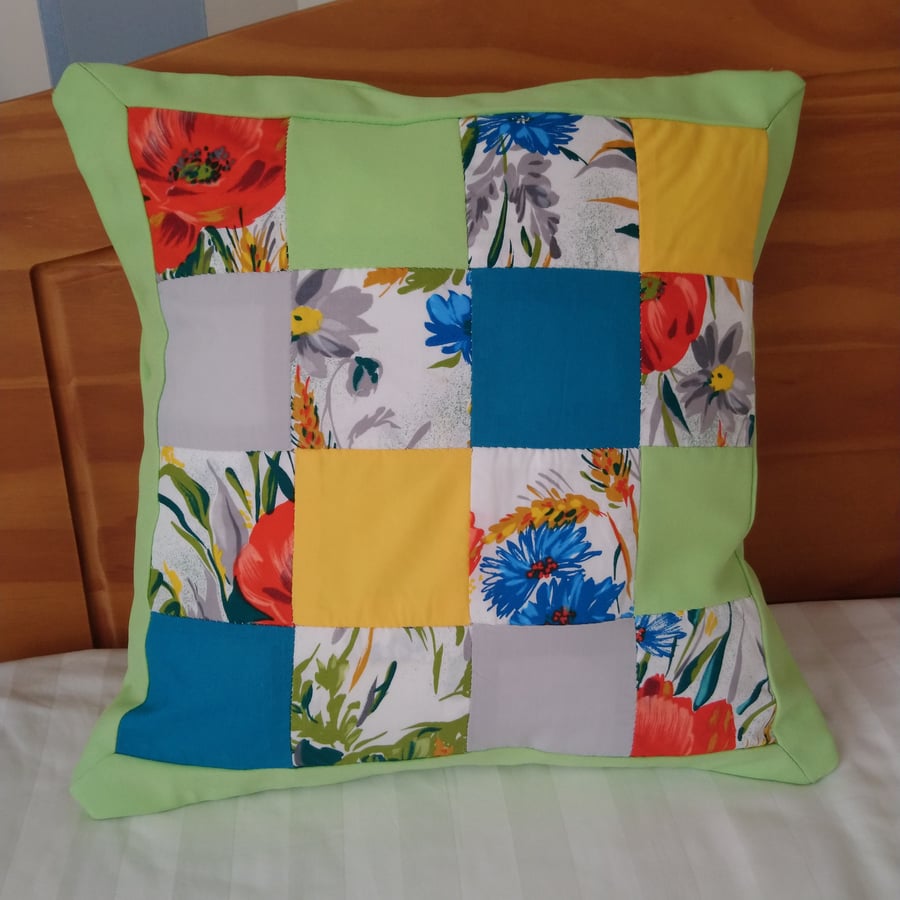 Patchwork cushion covers in lime green, turquoise, yellow, grey and floral. 