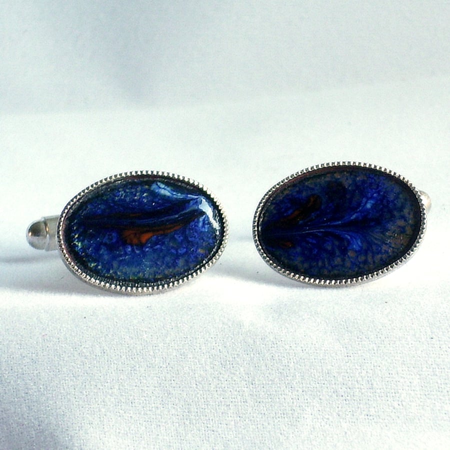 enamel cufflinks - oval: scrolled red on blue over clear