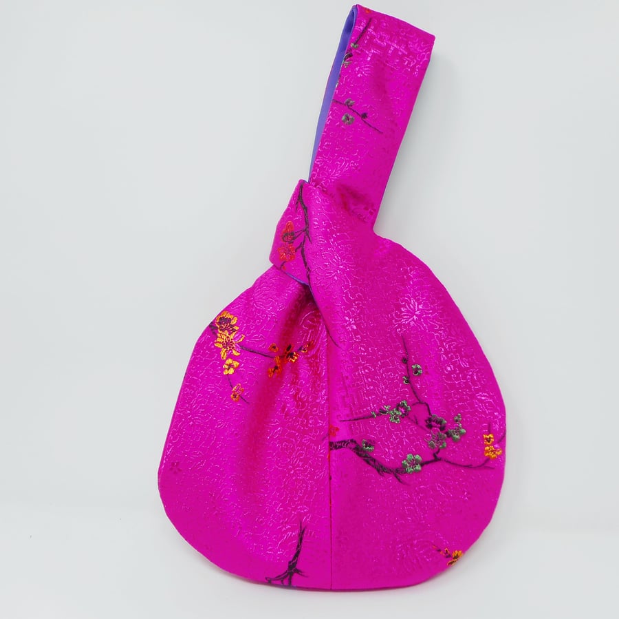 Beautifully made Japanese knot bag in vibrant pink satin