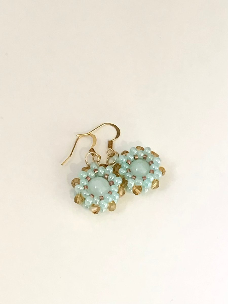 Beaded blue-green and gold wheel earrings