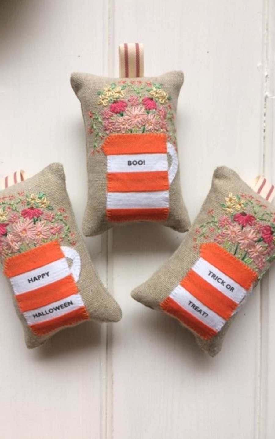 Orange and white personalised lavender bag with hand embroidered flowers