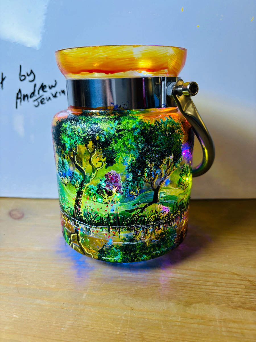 A hand painted and fired metal and glass lantern by Andrew Jenkins 