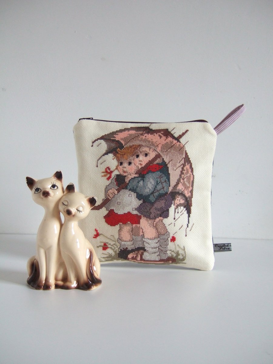 Make up bag with a cross stitch vintage embroidery of two children and a brolly