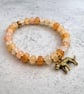 Glass bead charm bracelet 