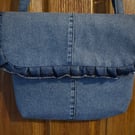 Repurposed blue denim handbag, shoulder or hand held strap length. Décor frill.