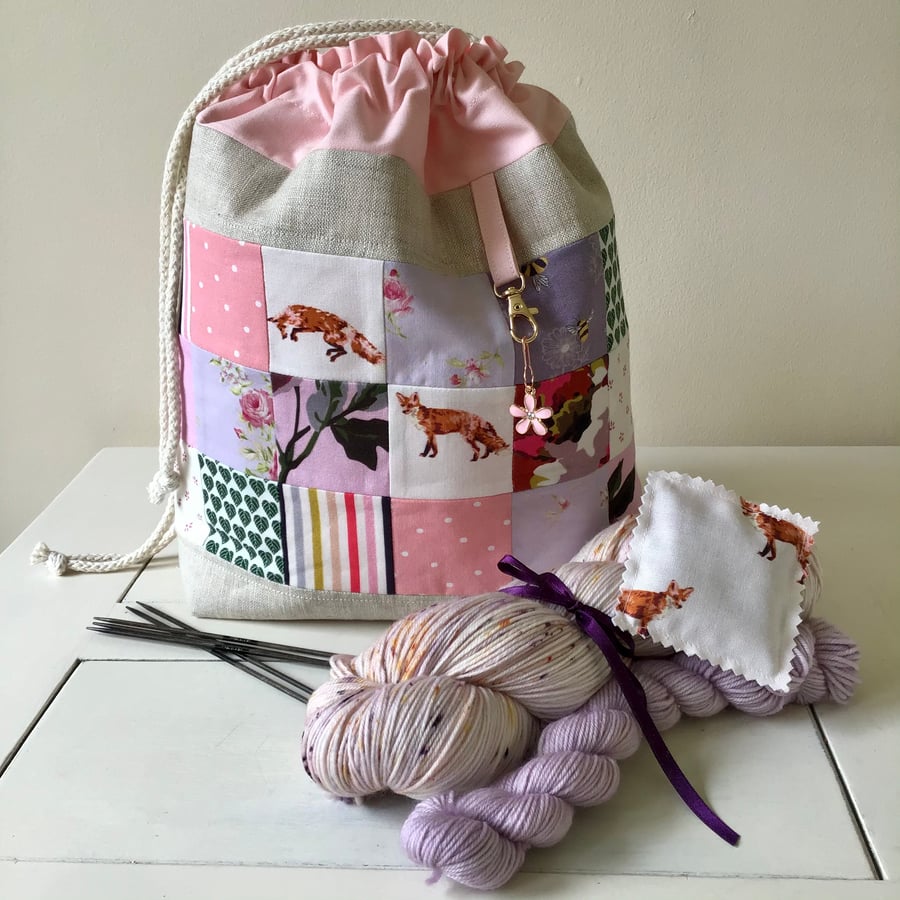 Lovely violet and peachy patchwork project bag.