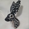 Faux hare head wall mount in black and grey spots