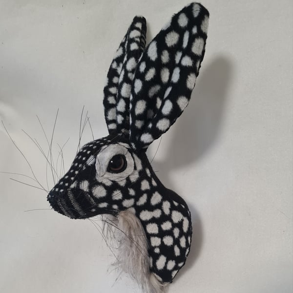 Faux hare head wall mount in black and grey spots