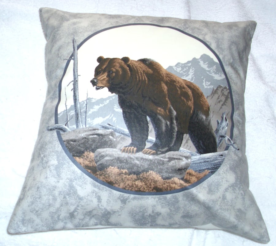 Brown Bear climbing up a mountain cushion