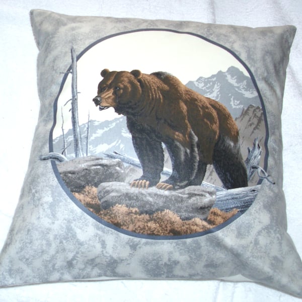Brown Bear climbing up a mountain cushion