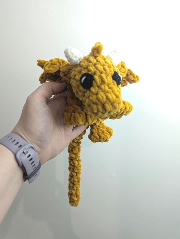 Plush crocheted dragon lovey, soft cuddly toy