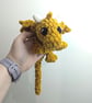 Plush crocheted dragon lovey, soft cuddly toy