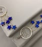 Blue Hematite Star Dangle Drop Earrings - Image 1